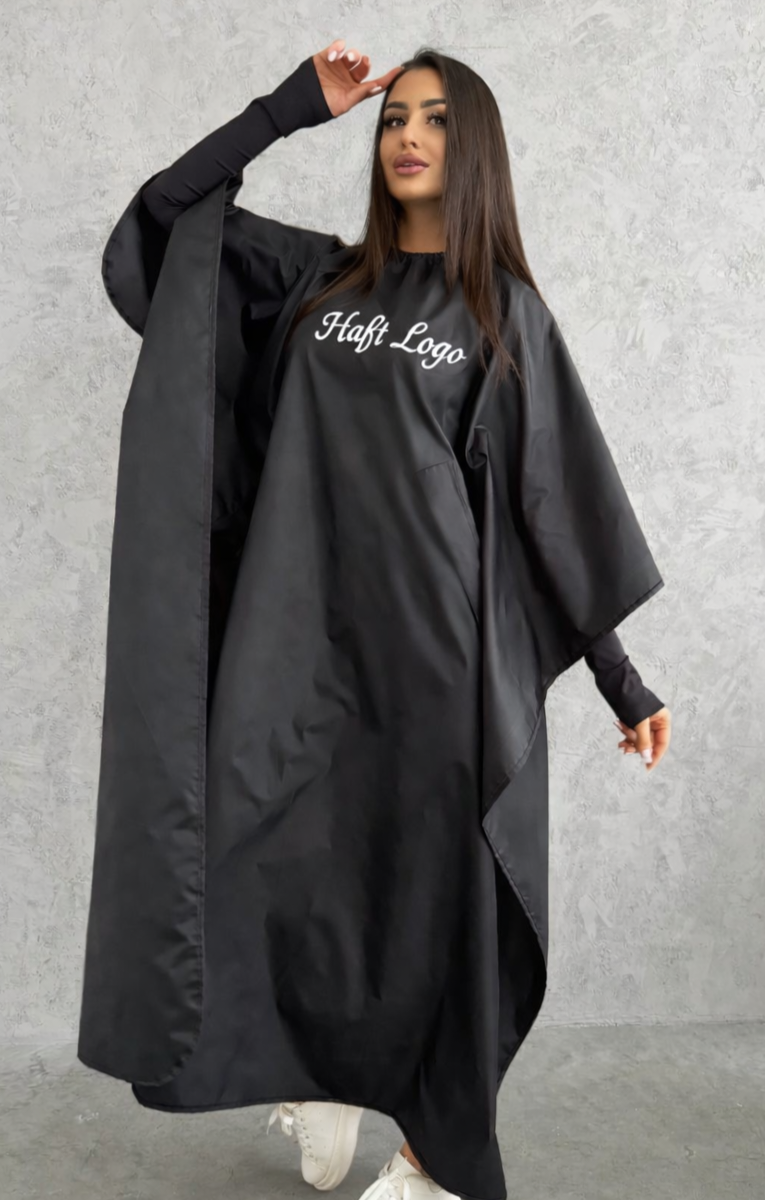 Haft na pelerynie fryzjerskiej