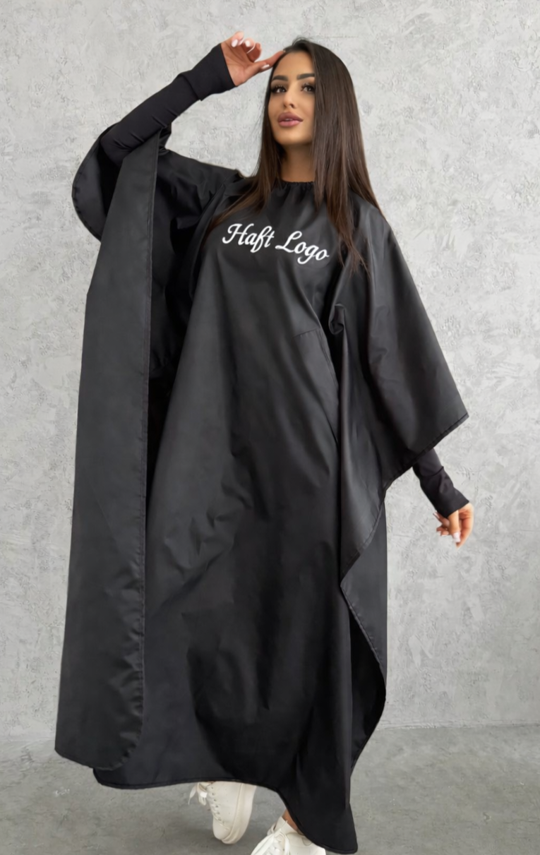 Haft na pelerynie fryzjerskiej